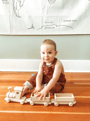 child playing with Large Wooden Toy Train