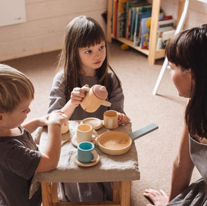 Children playing with a Pastel Wooden Toy Tea Set